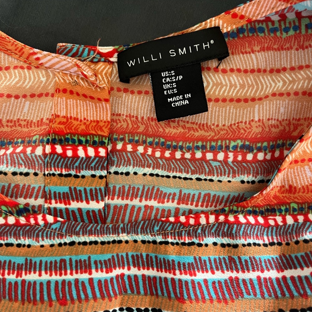 Sleeveless button-back blouse. Aztec, doodle, vibrant multi-color design.